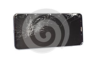 Black phone with a broken sensor and screen, cracked touchscreen glass on a white background isloate