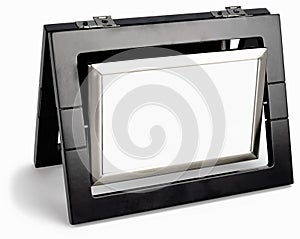 Black photo frame rotated in a plane isolated
