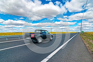Black pickup fast move on asphalt tarmac highway wanderlust