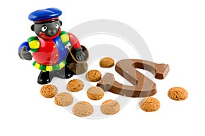 Black Piet with pepernoten and chocolate letter