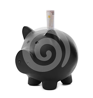 Black piggy bank with money