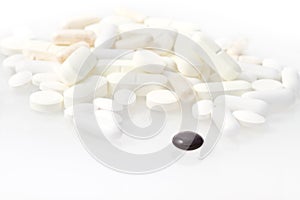 Black pill among white ones