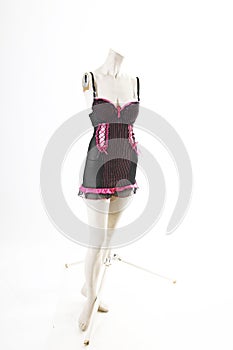 Black pink Babydoll lingerie on mannequin full body shop display. Woman fashion styles, clothes on white studio background.