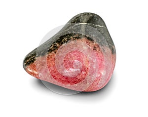 Black and pink colored rhodonite stone, isolated on white background. Rounded smooth surface.