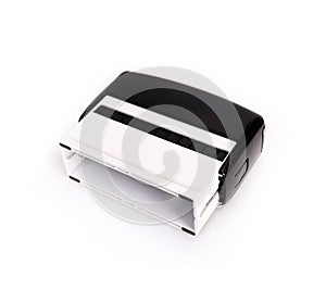 Black plastic automatic stamp for documents isolated on white background