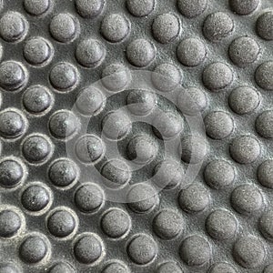 Black plastic background, circular embossed