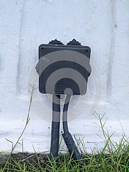 Black plastic box for cable connection.