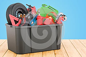 Black plastic box full of car tools, equipment and accessories on the wooden table, 3D rendering