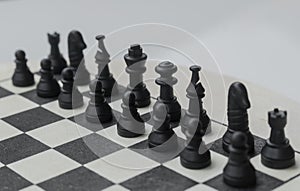 Black plastic Chess Pieces on natural wooden board, Chessboard selective focus of pawns and chess game set up