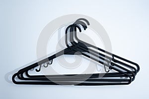 Black Plastic Clothes Hanger on White Background