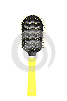 Black plastic comb with a yellow handle