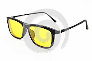 Black plastic frame yellow lens glasses, glasses isolated on white background