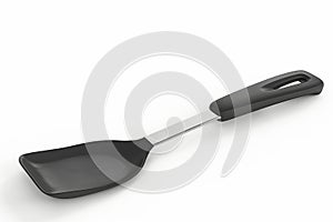 Black plastic kitchen spatula on white background. Modern kitchenware for cooking and serving. Essential tool for non