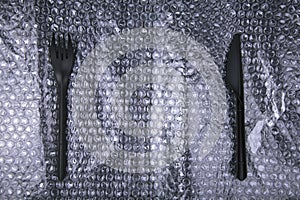 Black plastic knife and fork