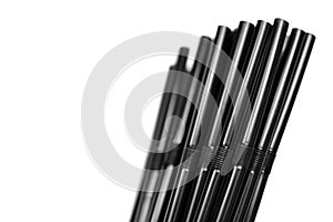 Black plastic plastic drinking straws isolated on white background