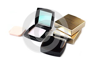 Black plastic powder compact case with a mirror. Cosmetic face powder or makeup puff