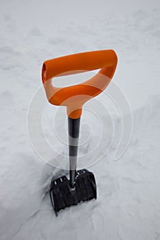 Black plastic shovel for snow removal