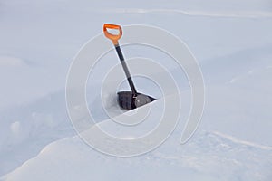 Black plastic shovel for snow removal