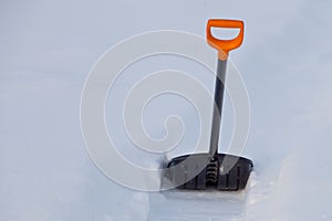 Black plastic shovel for snow removal