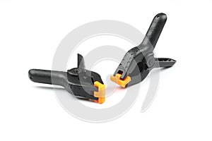 black plastic spring clamp isolated over white background