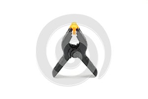 black plastic spring clamp isolated over white background