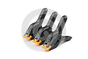 black plastic spring clamp isolated over white background