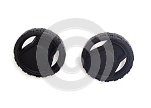 Black plastic wheels from a pressure washer on a white background, isolate. Close-up