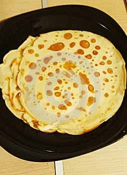 black plate with delicious pancakes