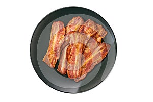 black plate with fried bacon isolated on white background. Top view. Plate with fried bacon on white background