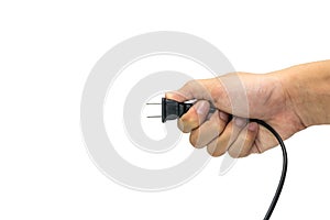 Black plug was holding in hand in white background. 2