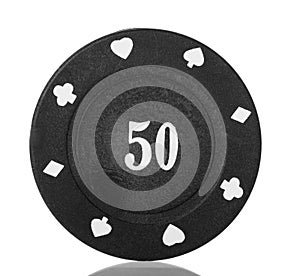 Black poker chip close-up isolated on white.
