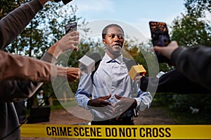 Black Police Officer Giving Interview photo