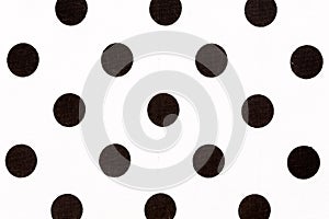 Black polka dot over white fabric background. High quality texture.