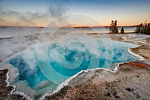 Black Pool at West Thumb Geyser Basin Trail during wonderful colorful sunset, Yellowstone National Park, Wyoming