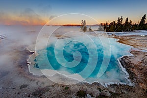 Black Pool at West Thumb Geyser Basin Trail during wonderful colorful sunset, Yellowstone National Park, Wyoming