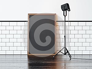 Black poster and lamp, white wall. 3d rendering photo