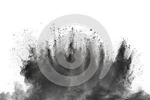Black powder explosion against white background. Charcoal dust particles exhale in the air