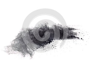 Black powder explosion. Closeup of black dust particles explode isolated on white background