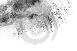 Black powder explosion. The particles of charcoal splatter on white background.