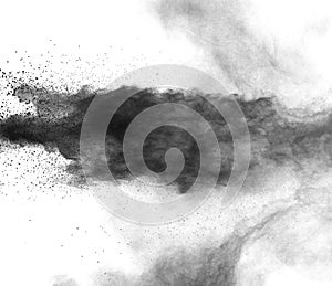 Black powder explosion on white background.Black dust particles splash