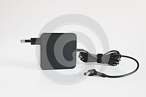 Black power ac to dc adaptor. Power adapter of computer