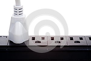 A black power strip with empty outlets