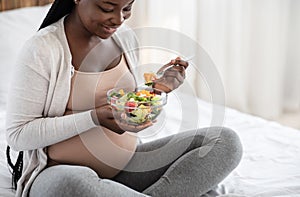 Black Pregnant Woman Holding Bowl With Fresh Vegetable Salad, Enjoying Healthy Nutrition