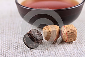 The black pressed Chinese tea on a linen napkin