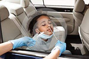 Black Preteen Girl Getting Tested For Covid-19 Sitting In Car