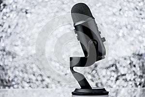 Black Profesional Microphone On Blurred Background photo