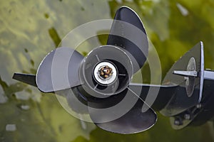 Black propeller over the water