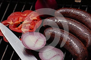 Black pudding with onion and pepper