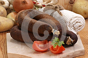 black pudding on a timber board