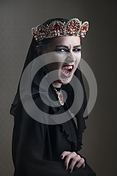 Black queen in a crown of rubies, scream